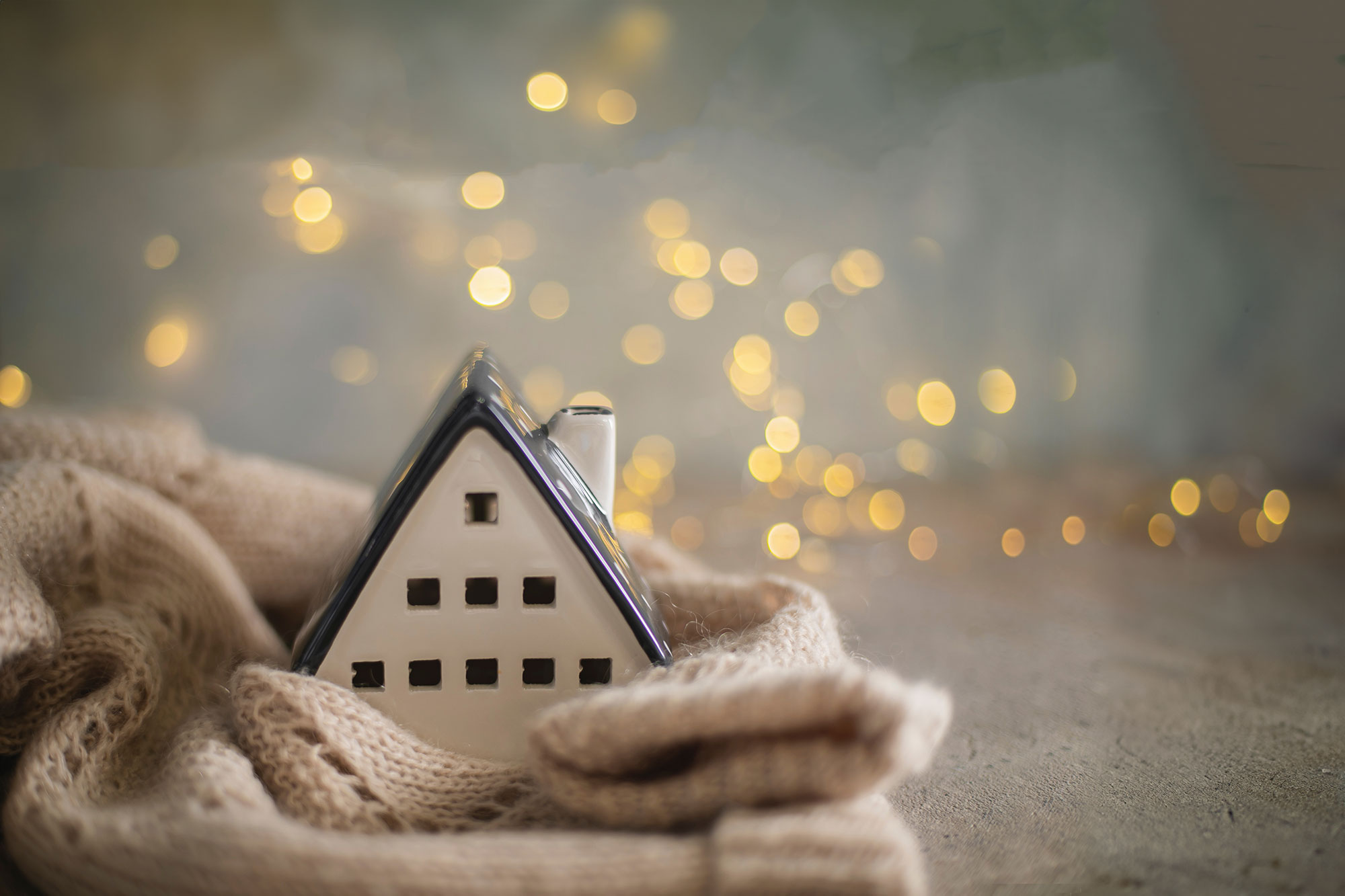 A cozy little home wrapped in a blanket ina magical setting.